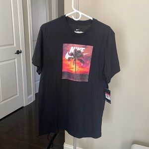 The Nike Tee. Black with pictured design. NWT, size: LG